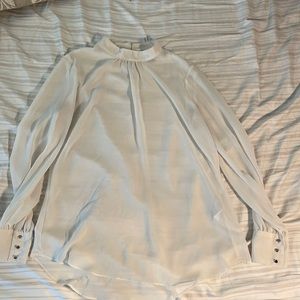 Sheer white long-sleeve mock-neck blouse